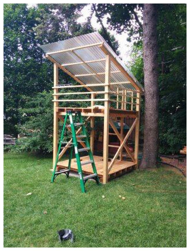 An elevated backyard platform fort with a timber frame and a corrugated-metal roof.